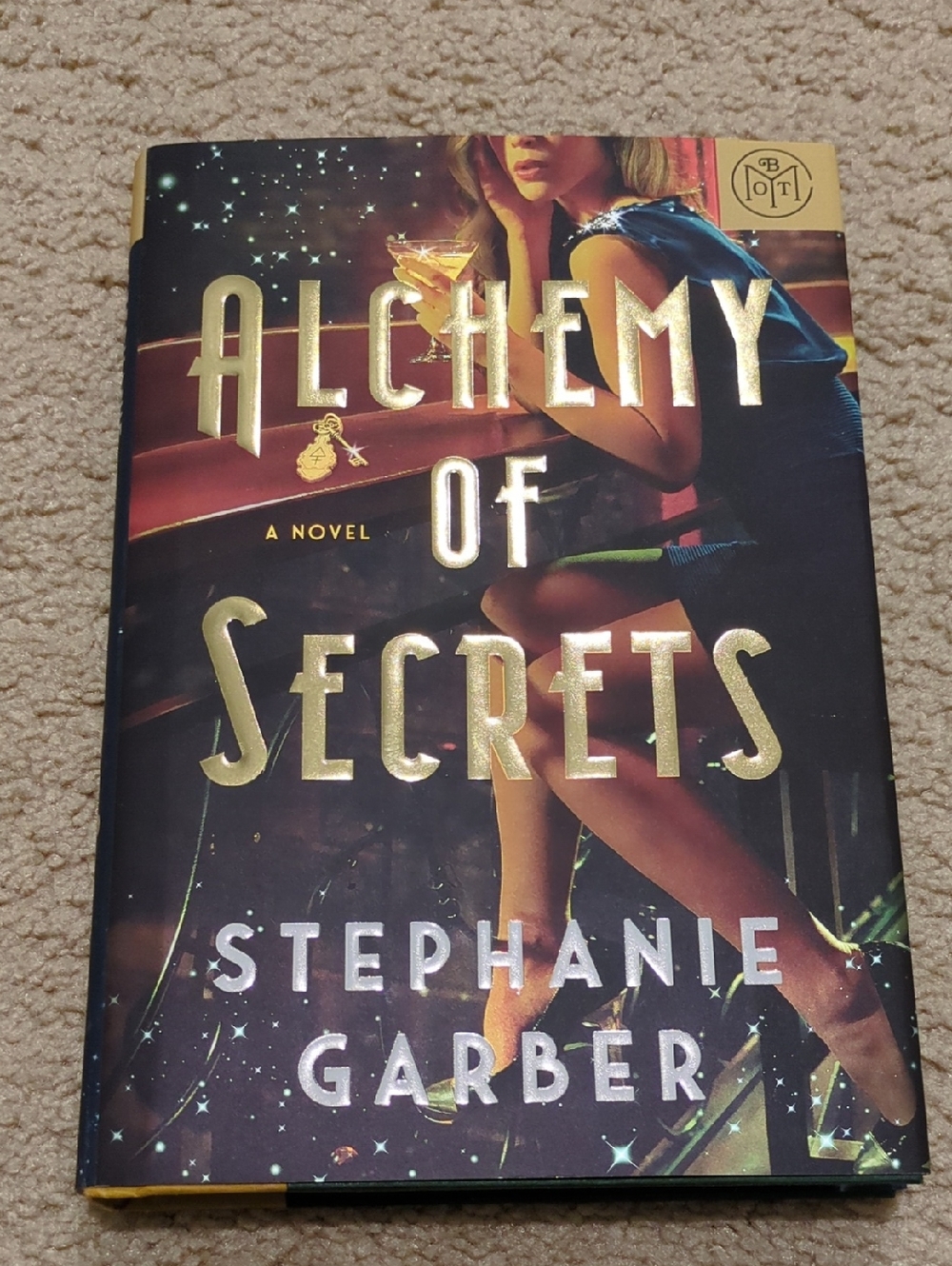 Alchemy of Secrets by Stephanie Garber - Gold & Black Hardcover